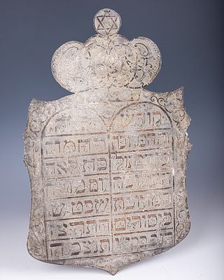 1. AN EARLY SILVER PAROCHET DECORATION. Probably Egypt, 1942. Finely engraved with a dedication 