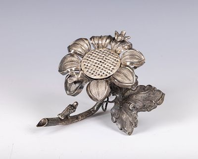 7. A SUNFLOWER SHAPED SPICE CONTAINER. Continental, 20th century. Further decorated with three 