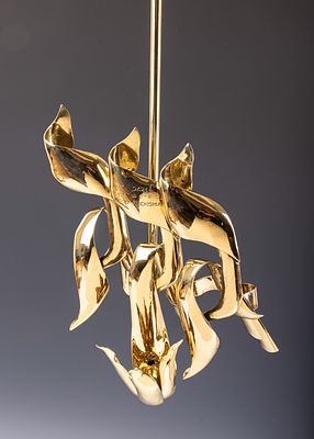 10. A LARGE POLISHED BRASS ETERNAL LIGHT. American, c. 1960â€™s. Hand formed with three letter. 1 