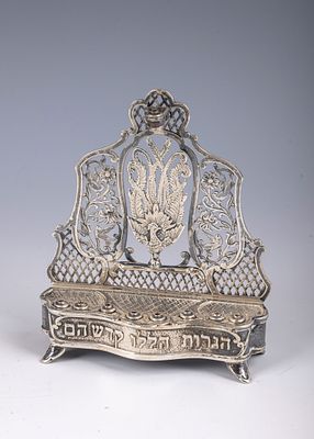 22. A SILVER HANUKKAH LAMP BY REICHMAN BROTHERS. Jerusalem, c. 1980. On four feet. With a 