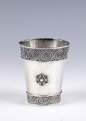 24. A SILVER KIDDUSH CUP BY BEZALEL. Jerusalem, c. 19350. Beaker form. Decorated with applied 