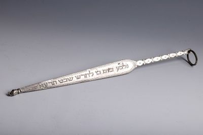48. A SILVER TORAH POINTER. Probably Morocco, c. 1913. In traditional form. Engraved on one 