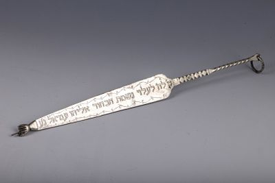 49. A SILVER TORAH POINTER. Probably Morocco, c. 1913. In traditional form. Engraved on one 