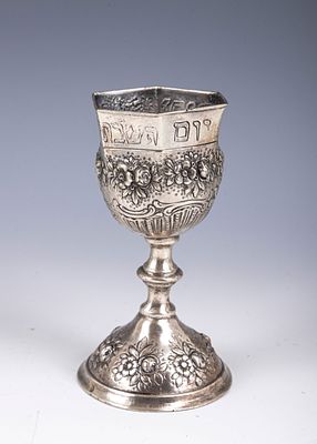 50. AN OCTAGONAL SILVER KIDDUSH GOBLET. Germany, c. 1900. On a round base decorated with 