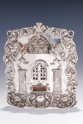 A SILVER TORAH SHIELD BY ANTON RIEDEL. Warsaw, 1874. Hand chased with flowers, scrolling design 