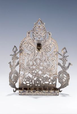 A SILVER HANUKKAH LAMP. Morocco or North Africa, c. 1900. Hand cut lattice work that includes 