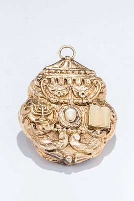 A SILVER AMULET. Italy, c. 1800. Hand chased with a temple style menorah, the Decalogue, a 