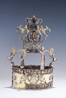 A RARE AND IMPORTANT SILVER TORAH CROWN. Tarnograd, Poland, c. 1880. The lower part is decorated 