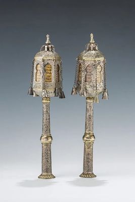 A PAIR OF SILVER TORAH FINIALS. Morocco, 19th century. Hand engraved bodies in “street