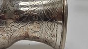 A SILVER KIDDUSH GOBLET. Vilna, 1879. On a stylized base with knobbed stem and skirted תמונה - 1