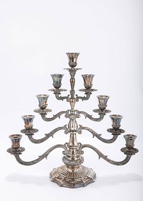 A STERLING SILVER MENORAH BY BUCCELATI. Italy, c. 1990. On a stylized circular base with