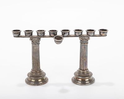 A STERLING SILVER MENORAH. Italy, modern. Signed by Zacaro and marked 925. On two columns that 