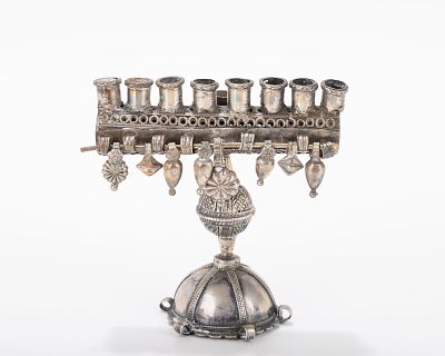 A SMALL HANDMADE HANUKKAH LAMP. Probably Israel, modern. On a domed round base. The upper 