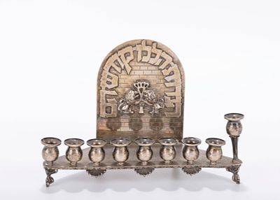 A STERLING SILVER HANUKKAH LAMP BY NETAFIM 55. Israel, c. 1980. The backplate with applied 