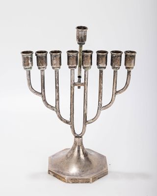 A SILVER HANUKKAH MENORAH. Vienna, c. 1920. On an octagon domed base with Art Deco upper 