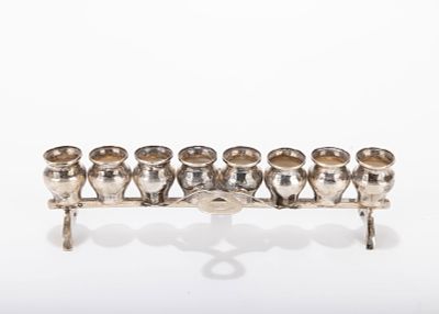 A SILVER HANUKKAH LAMP. Austria, c. 1900. The oil section only of a back plate style lamp. 7.1 