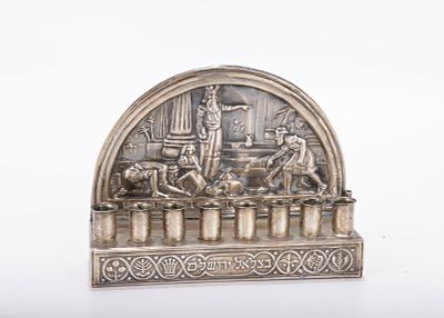 A SILVER HANUKKAH LAMP. Probably Israel, modern. Bezalel style. The backplate with Maccabe 