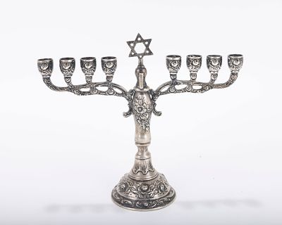 A SILVER HANUKKAH MENORAH. Germany, c. 1900. On a round domed base with traditional structure. 