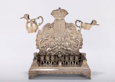 A STERLING SILVER HANUKKAH MENORAH. Hanau, Germany, 20th century. On a rectangular base with 