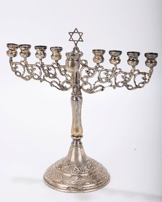 A STERLING SILVER HANUKKAH MENORAH. Israel, 20th century. On a domed round base with eight 