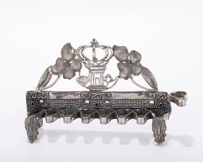 A SMALL HANDMADE HANUKKAH LAMP. Probably Israel, modern. On four legs. The back plate is 