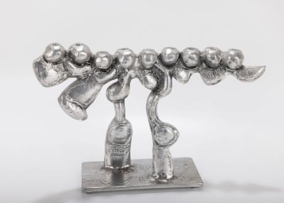 A LARGE ALUMINUM MENORAH SCULPTURE BY DON DRUMM (American, b. 1935). Abstract in design on 