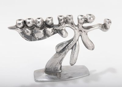 A LARGE ALUMINUM MENORAH SCULPTURE BY DON DRUMM (American, b. 1935). Abstract in design on 