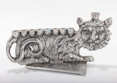 A LARGE ALUMINUM MENORAH SCULPTURE BY DON DRUMM (American, b. 1935). With a cat design, on a 