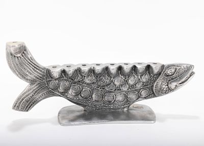 A LARGE ALUMINUM MENORAH SCULPTURE BY DON DRUMM (American, b. 1935). With a fish design, on a 