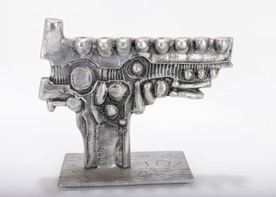 A LARGE ALUMINUM MENORAH SCULPTURE BY DON DRUMM (American, b. 1935). A ALUMINUM MENORAH 