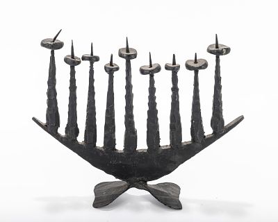 A LARGE CHANUKAH MENORAH BY DAVID PALOMBO (1920 - 1966). Israel. Black metal in stylized 