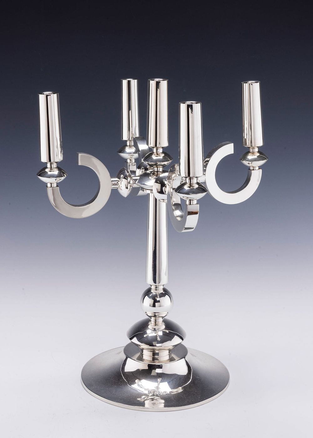 A LARGE STERLING SILVER SABBATH CANDELABRA BY CARMEL SHABI. Jerusalem, c. 1995. On round base 