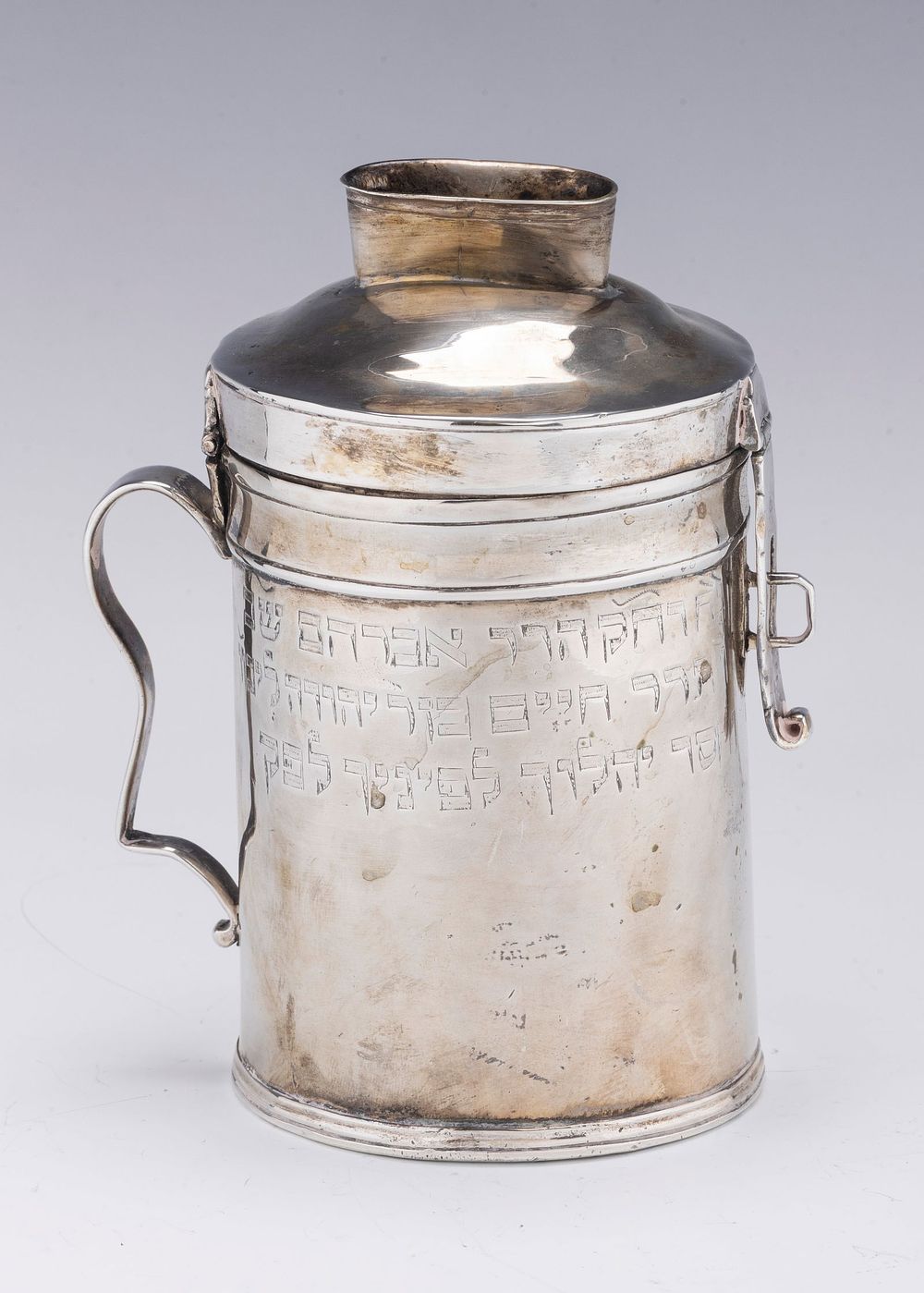 A RARE AND IMPORTANT SILVER CHARITY CONTAINER. Poland, c. 1790. Canister form with handle and 