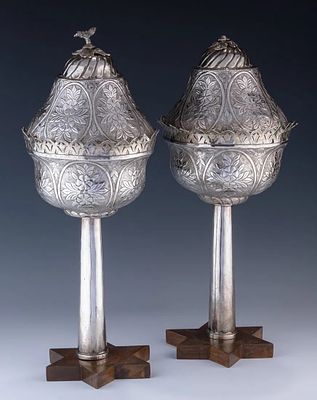 A MONUMENTAL PAIR OF SILVER TORAH FINIALS. Turkey, 19th century. In pomegranate form. With hand 