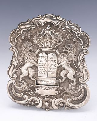 A SILVER TORAH SHIELD. Vienna, c. 1880. Traditional form. Decorated with two lions flanking a 
