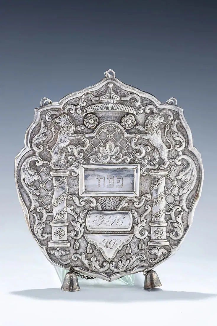 A RARE SILVER TORAH SHIELD. France (probably Strasbourg), c. 1850. Cartouche form. Embossed and 
