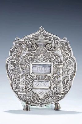 A RARE SILVER TORAH SHIELD. France (probably Strasbourg), c. 1850. Cartouche form. Embossed and 