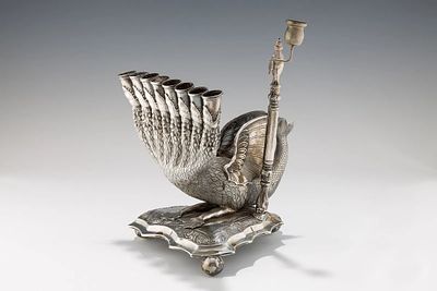 A RARE AND IMPORTANT HANUKKAH LAMP. Altenberg, c. 1830 - 50. On a stylized triangular base that 