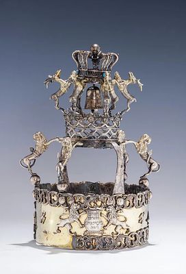 A RARE AND IMPORTANT SILVER TORAH CROWN TARNOGRAD, POLAND. Tarnograd, Poland, c. 1880. The lower 