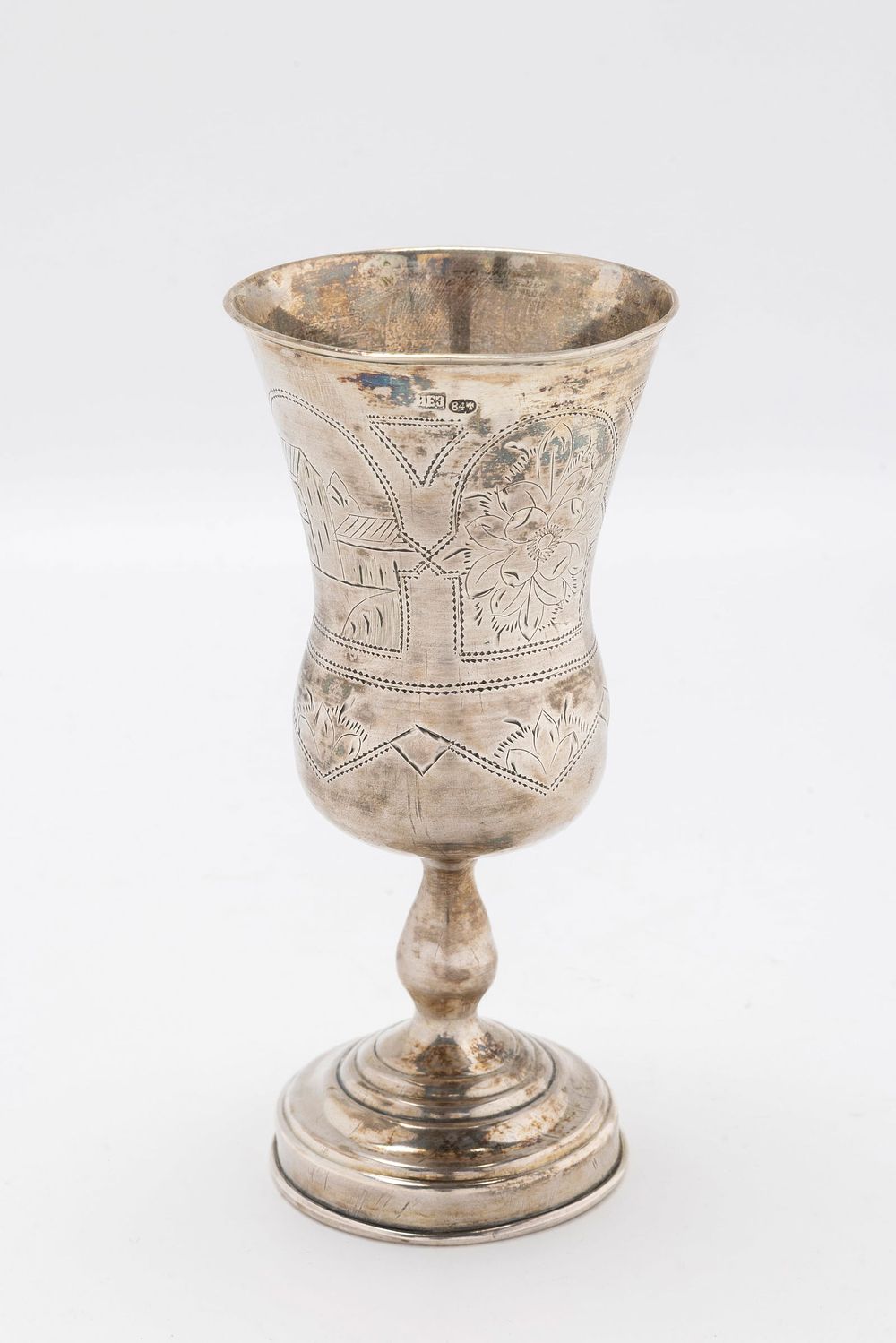 A LARGE SILVER KIDDUSH GOBLET. Russia, c. 1890. On a round baswe with supportive stem. Upper 