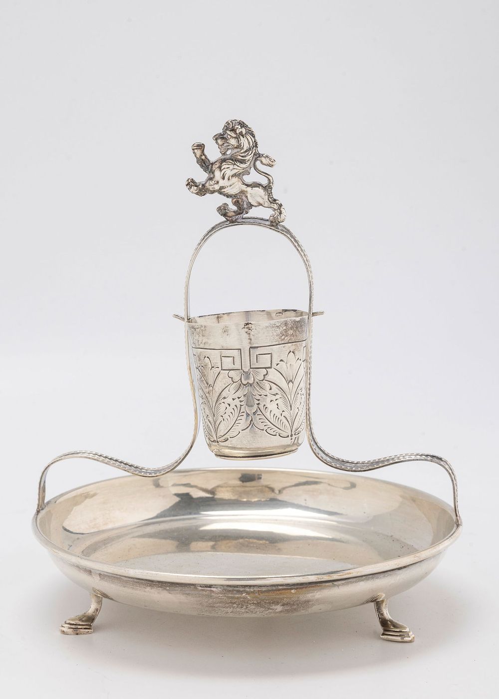 A STERLING SILVER MAYIM ACHRONIM. Probably American, c. 1950. On a round dish that is supported 