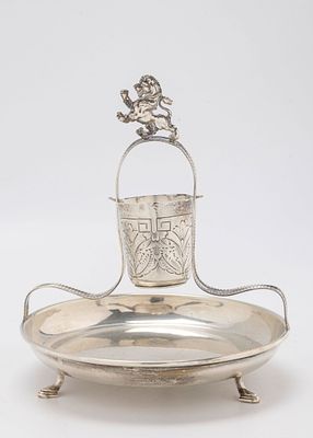 A STERLING SILVER MAYIM ACHRONIM. Probably American, c. 1950. On a round dish that is supported 