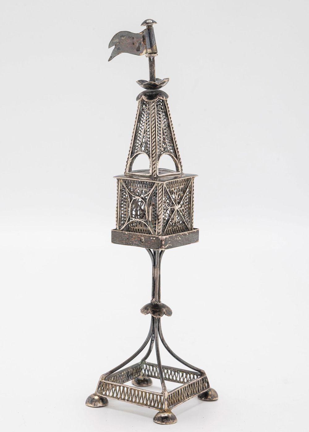 A SILVER SPICE TOWER. Vienna, c. 1890. On fourcupped feet and a square main section and tower 