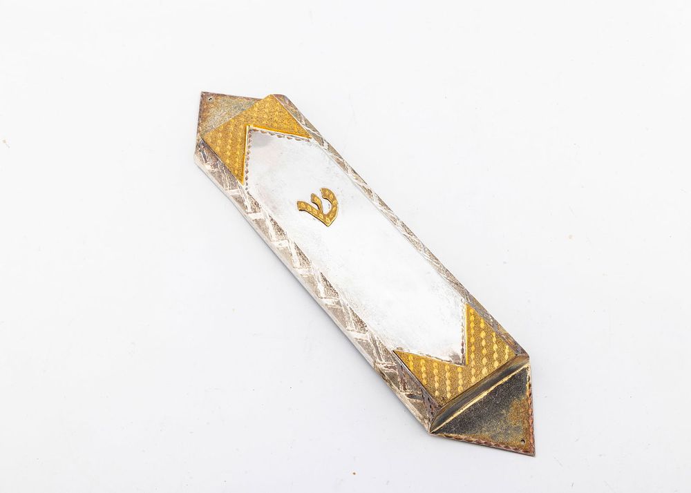 A LARGE STERLING SILVER MEZUZAH CASE. American, c. 2000. Bright cut design with the original 
