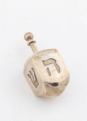 A SOLID STERLING SILVER DREIDEL BY TIFFANY. New York, c.1990. Engraved with the Hebrew letters 