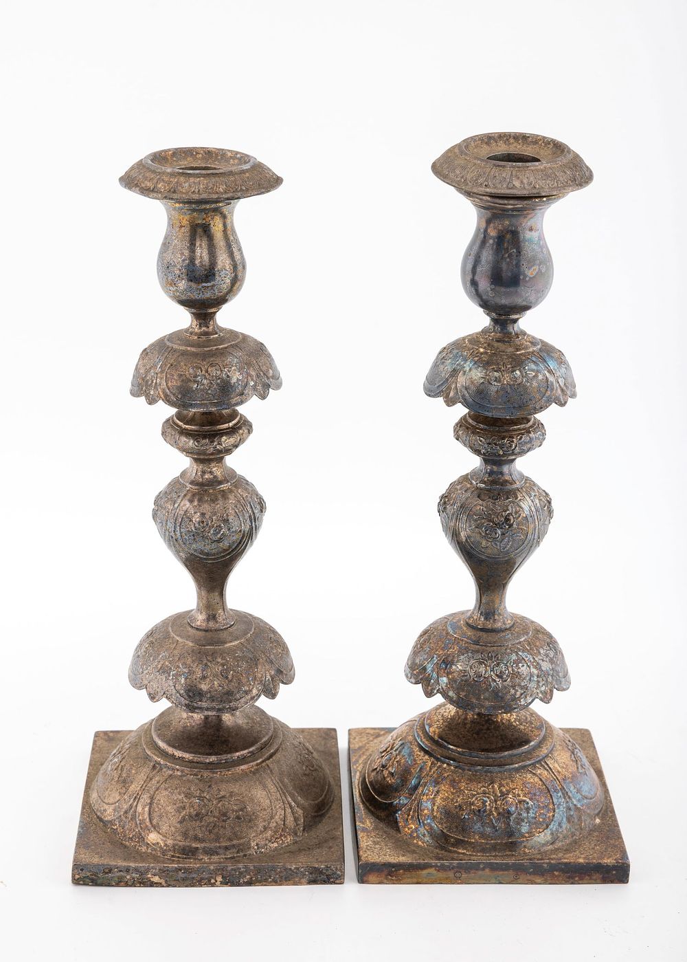 A PAIR OF BRASS SABBATH CANDLESTICKS BY NORBLIN. Warsaw, c. 1890. Peticoat design. On square 