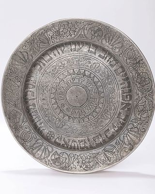 A GERMAN PEWTER PURIM PLATE. HALLE A. SAXE, 1750. Engraved with flowers, shells, and fruits 