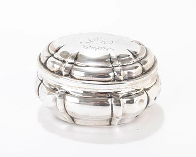 A SILVER ETROG BOX. Augsburg, 18th century. Oval form with removable cover that is inscribed 