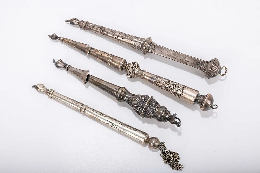 A GROUP OF FOUR SILVER TORAH POINTERS. Vintage and antique. The largest one is 10.5 inches.