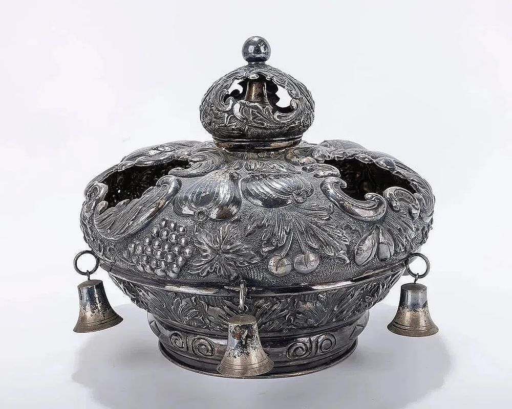 A SILVER TORAH CROWN. Hungarian, 20th century. Chased with fruits, scrolls and other organic 